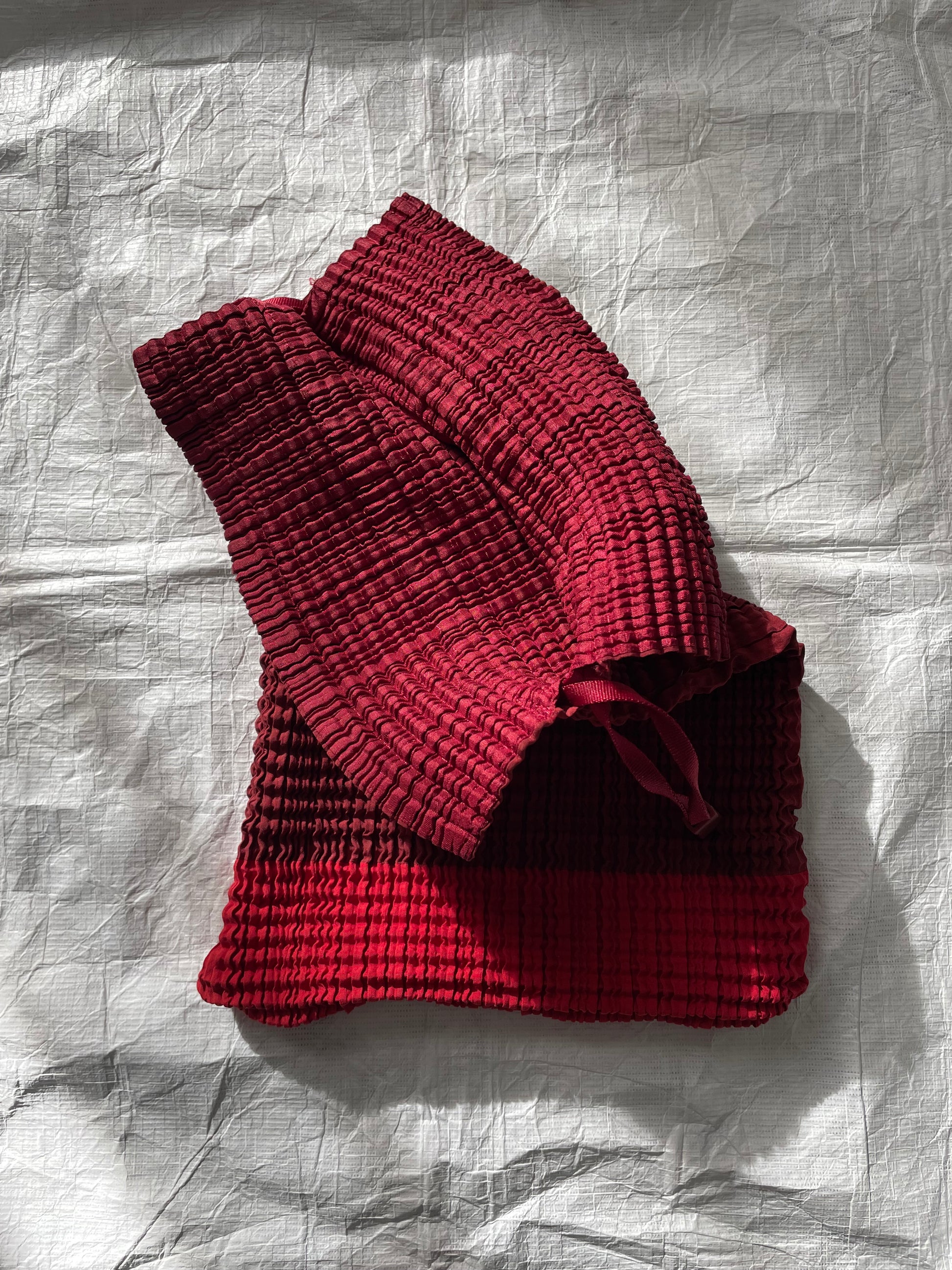 Issey Miyake red drawstring bag