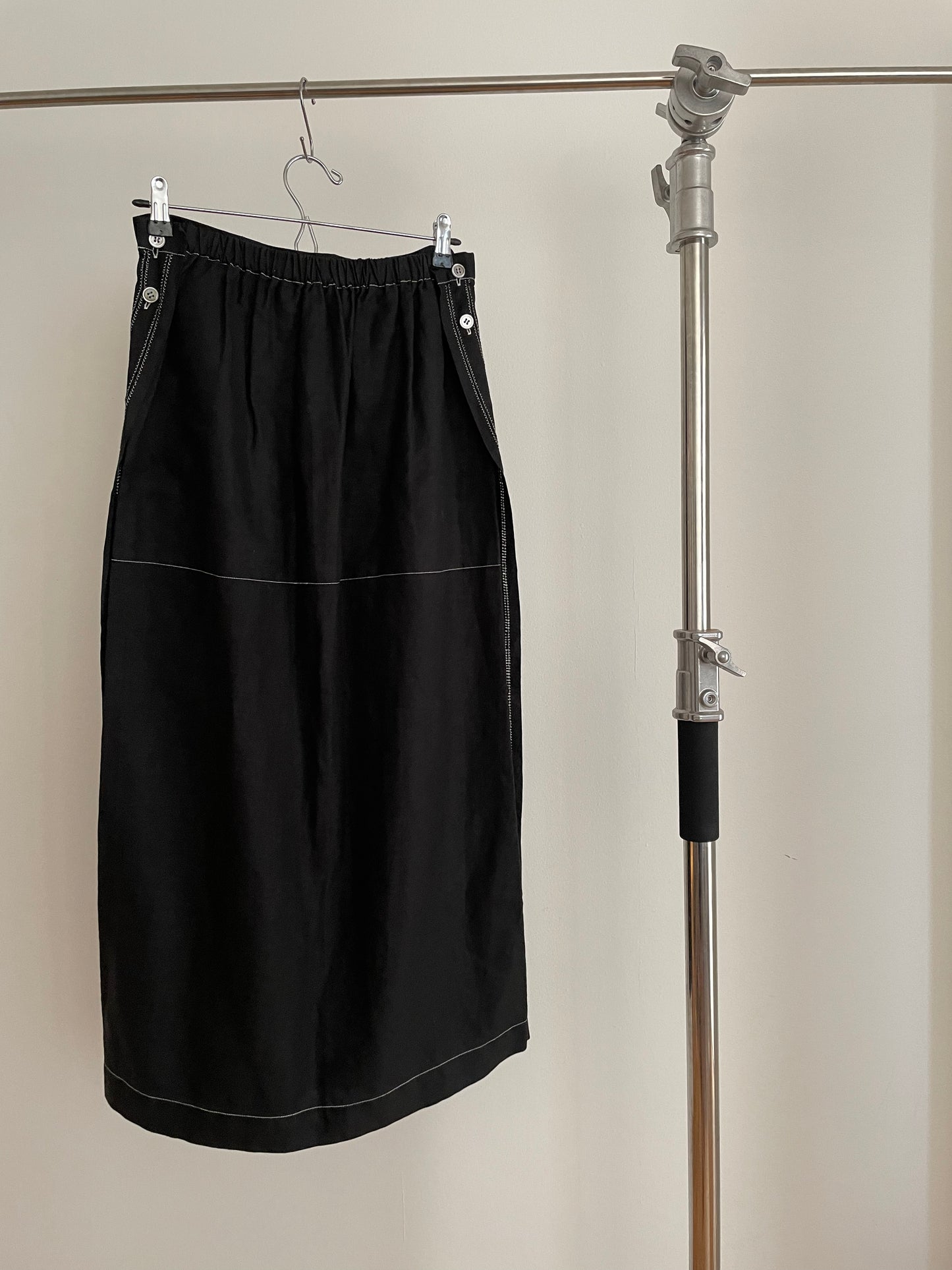 Back view of womens vintage Issey Miyake black skirt with white contrast stitch
