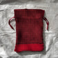 Issey Miyake red drawstring bag