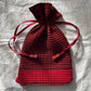 Issey Miyake red drawstring bag