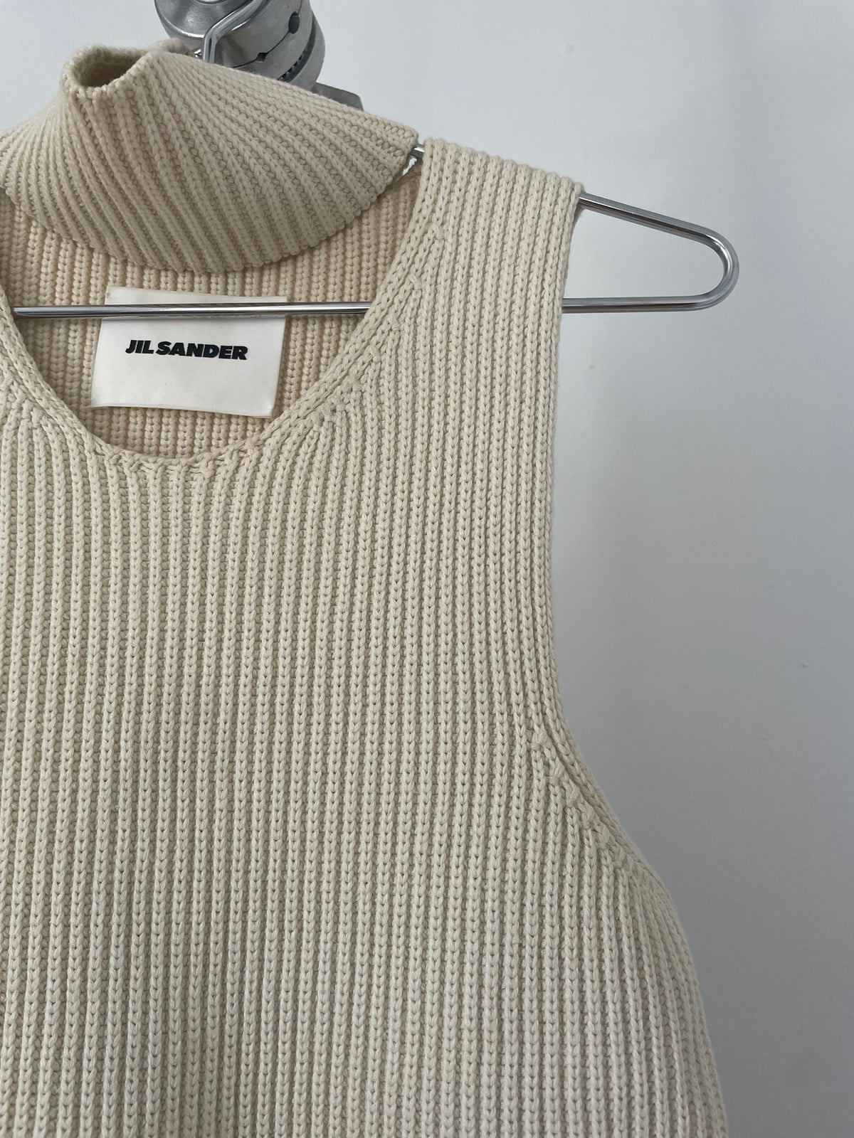 Jil Sander cream sleeveless cutout rib knit turtleneck