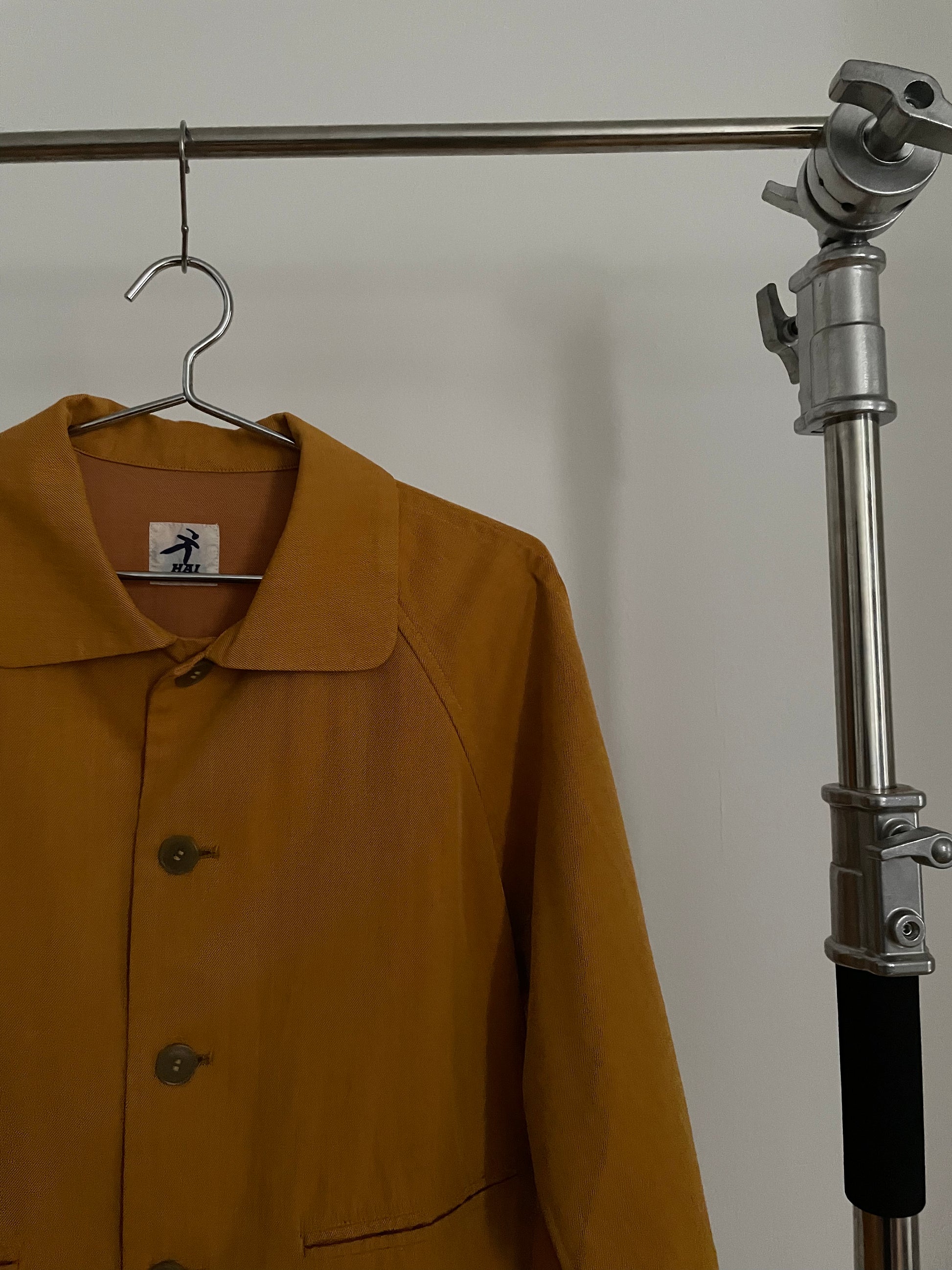 Detail view of vintage womens HAI Sporting Gear mustard yellow chore coat