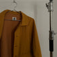 Detail view of vintage womens HAI Sporting Gear mustard yellow chore coat