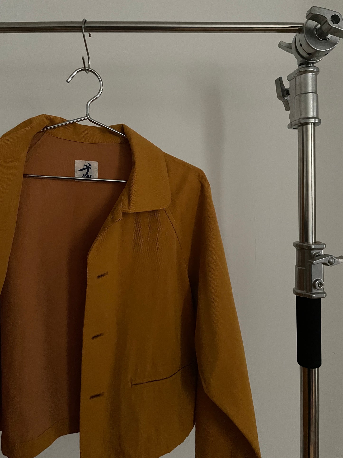 Detail view of vintage womens HAI Sporting Gear mustard yellow chore coat