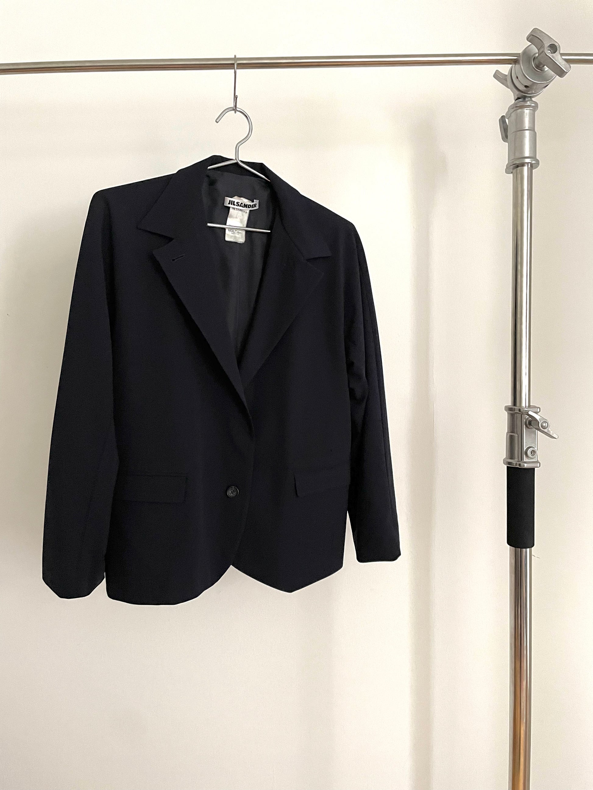 Front view of vintage womens Jil Sander two-button navy blazer