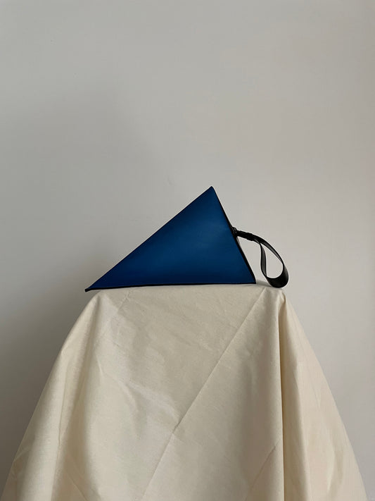 Issey Miyake blue and black triangle clutch with strap
