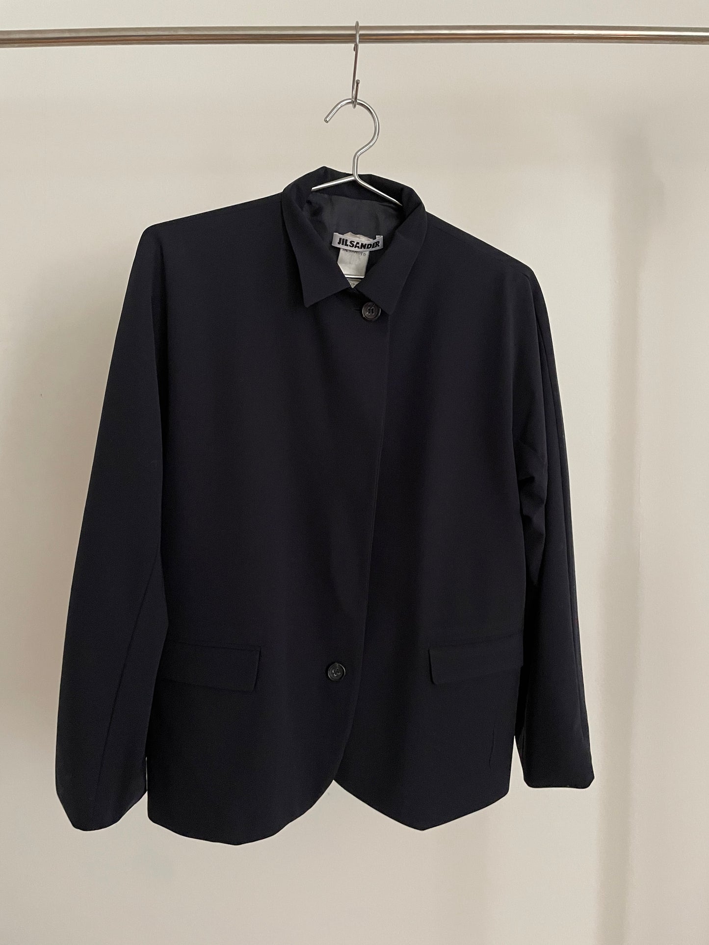 Front view of vintage womens Jil Sander two-button navy blazer