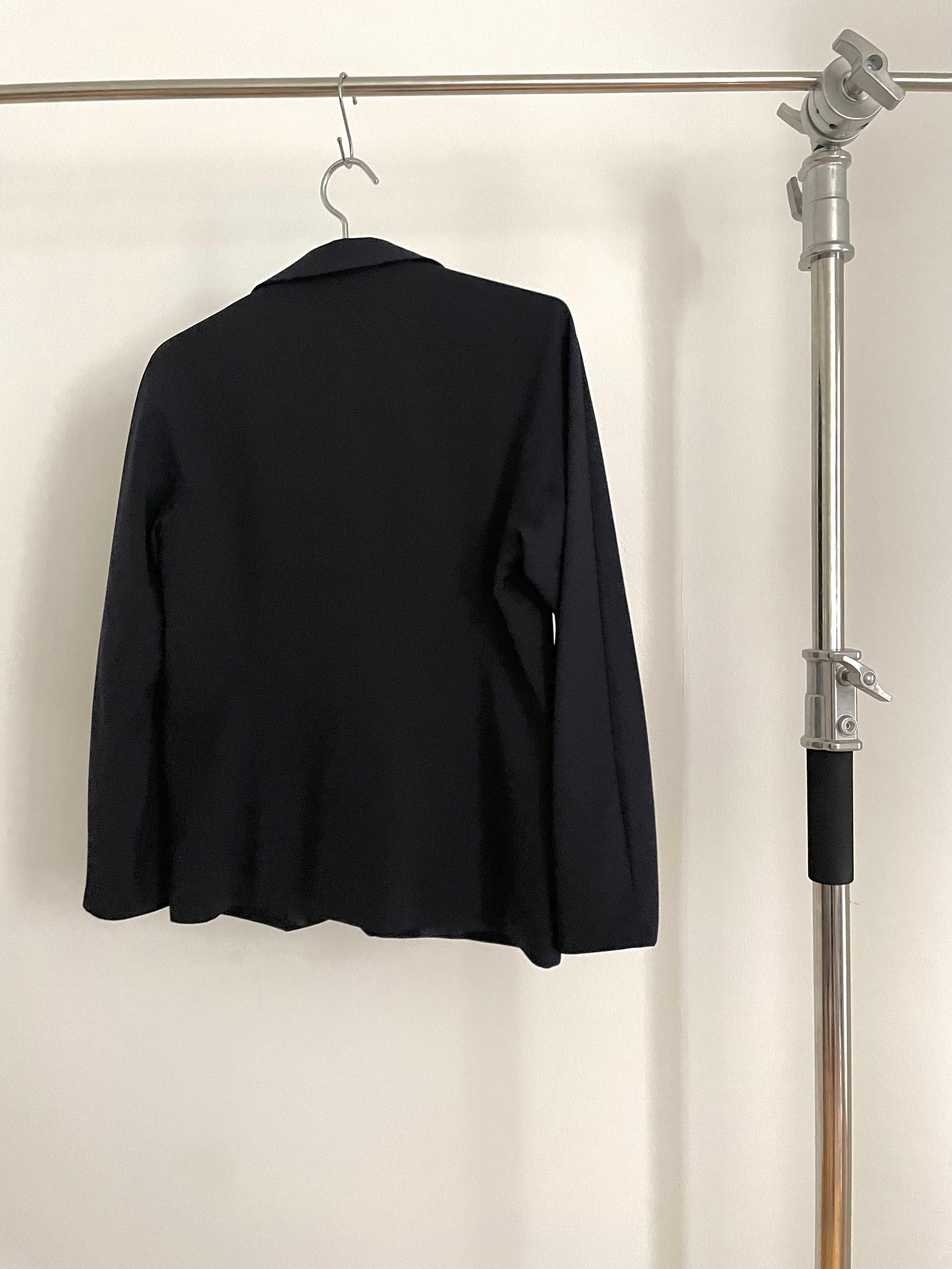 Back view of vintage womens Jil Sander two-button navy blazer