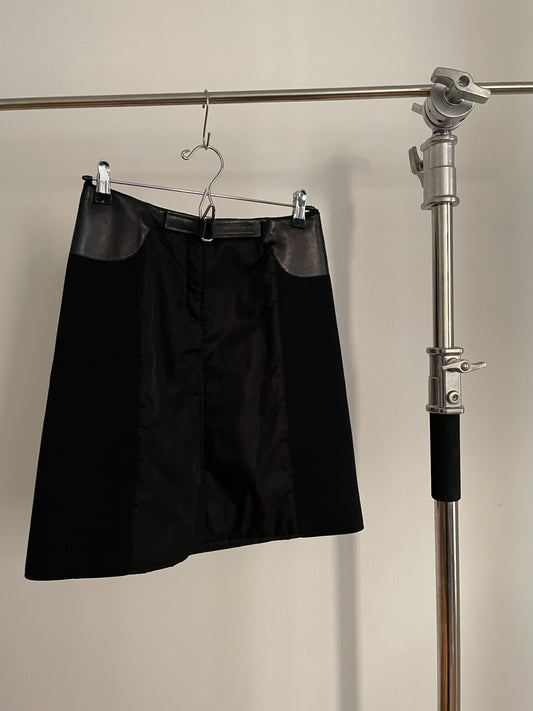 Front view of vintage womens black Prada skirt in nylon and neoprene with leather details