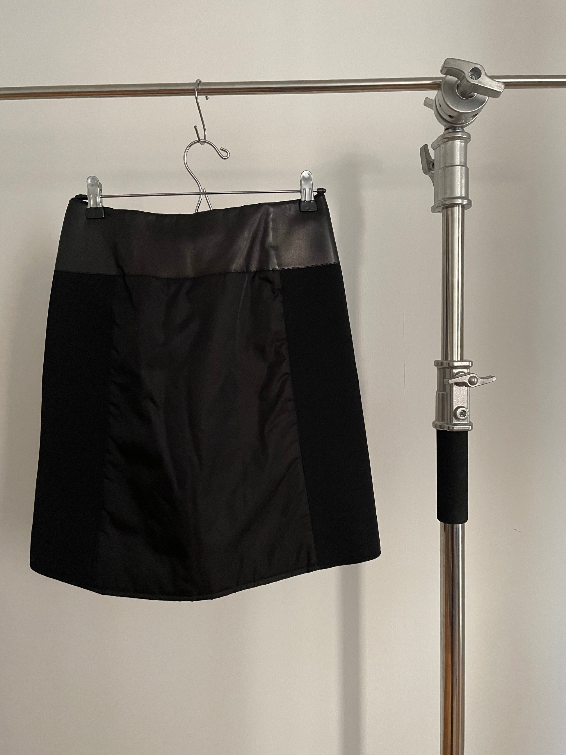 Back view of vintage womens black Prada skirt in nylon and neoprene with leather details