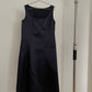 Front view of vintage womens Comme des Garçons black midi dress with geometric panels