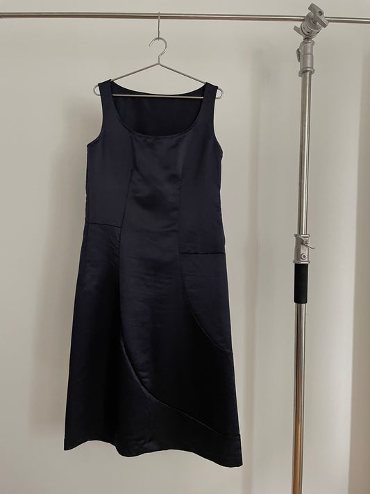 Front view of vintage womens Comme des Garçons black midi dress with geometric panels