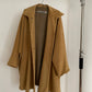 Front view of vintage womens Jil Sander 1980s camel dolman sleeve coat