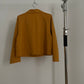 Back view of vintage womens HAI Sporting Gear mustard yellow chore coat