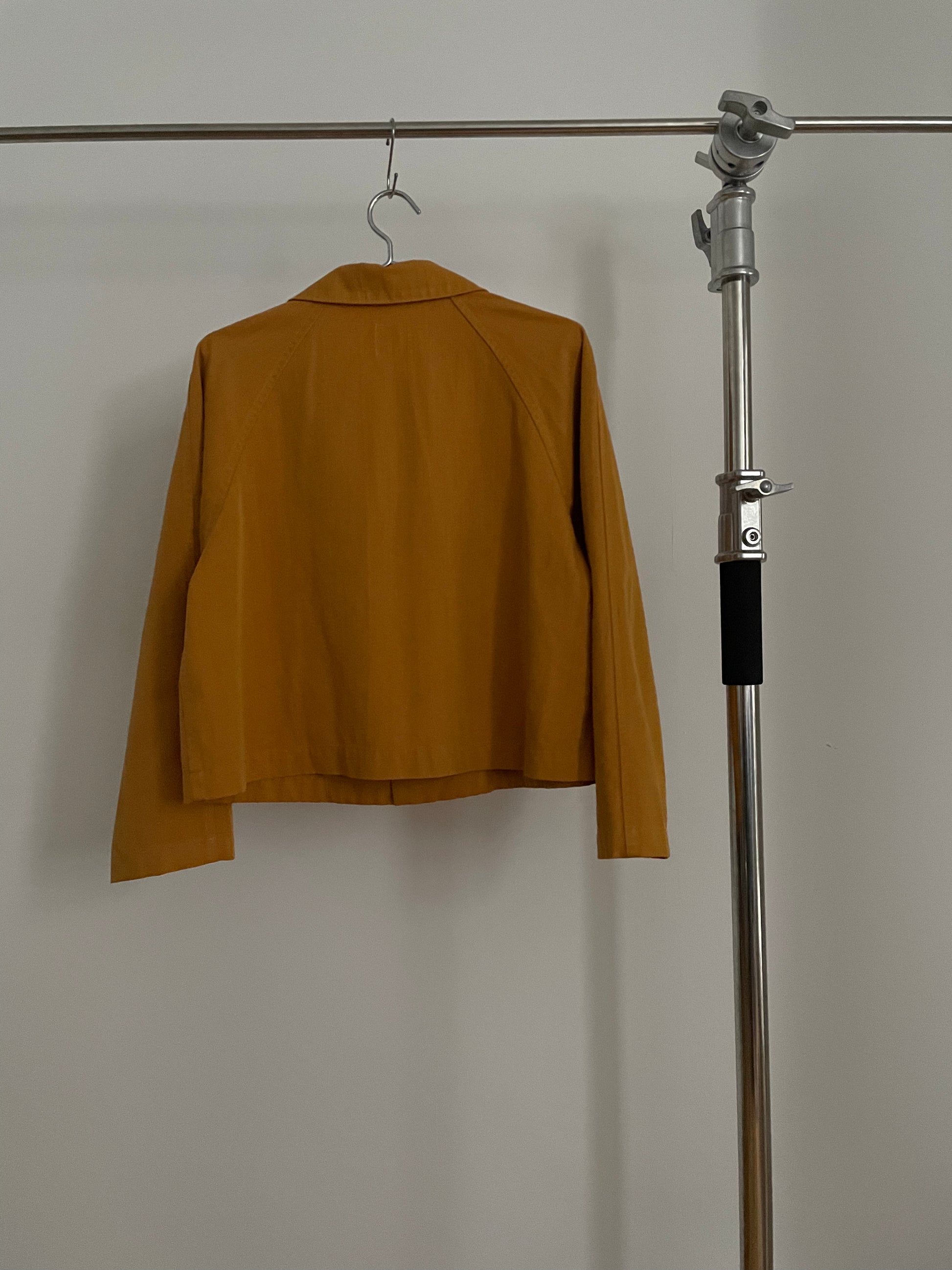 Back view of vintage womens HAI Sporting Gear mustard yellow chore coat