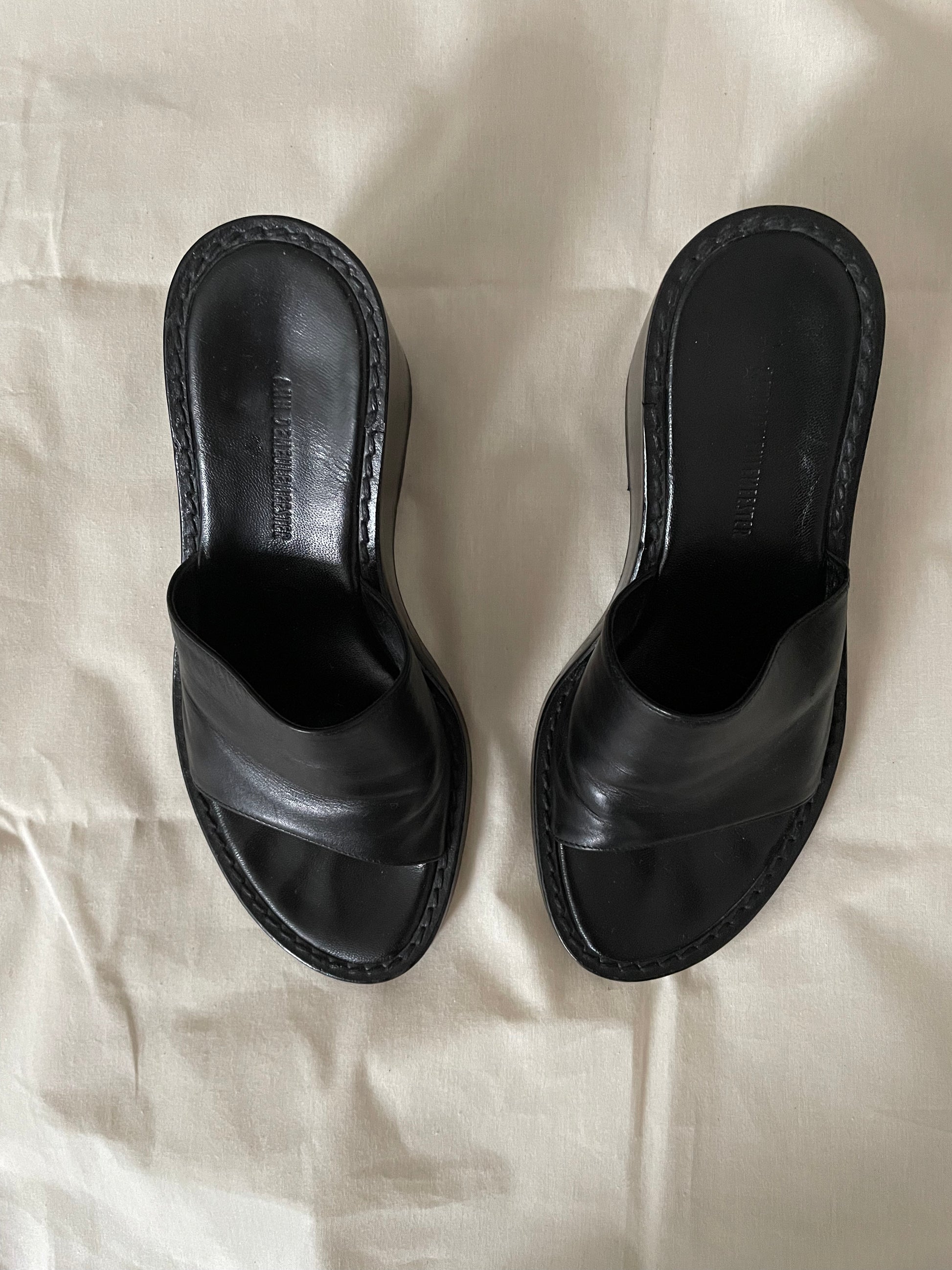 Top view of womens black Ann Demeulemeester wedge sandals
