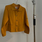 Front view of vintage womens HAI Sporting Gear mustard yellow chore coat