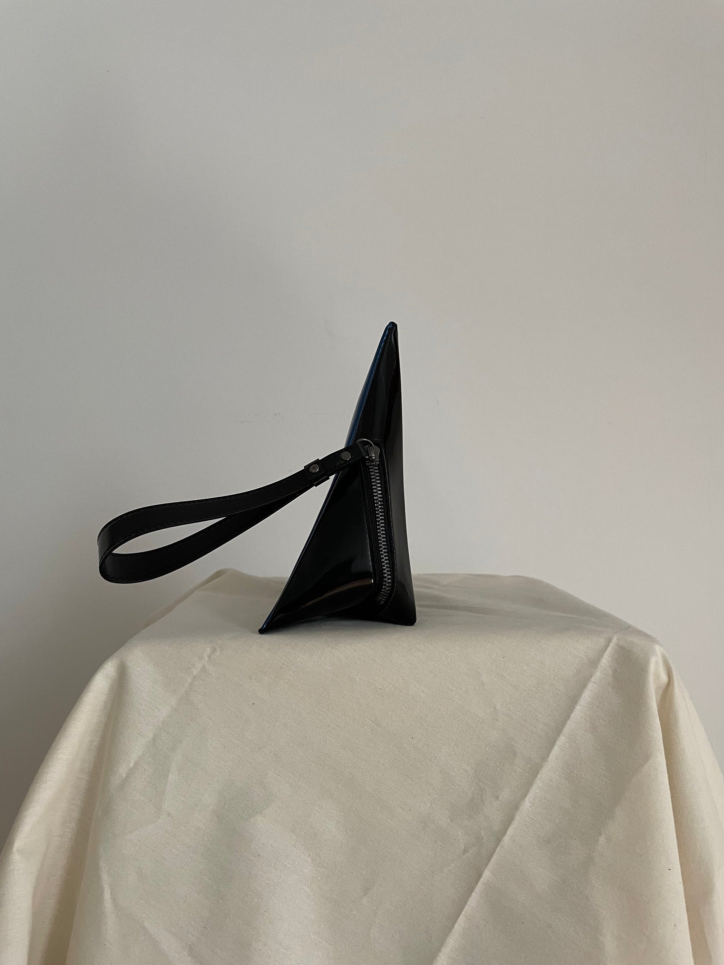 Issey Miyake blue and black triangle clutch with strap