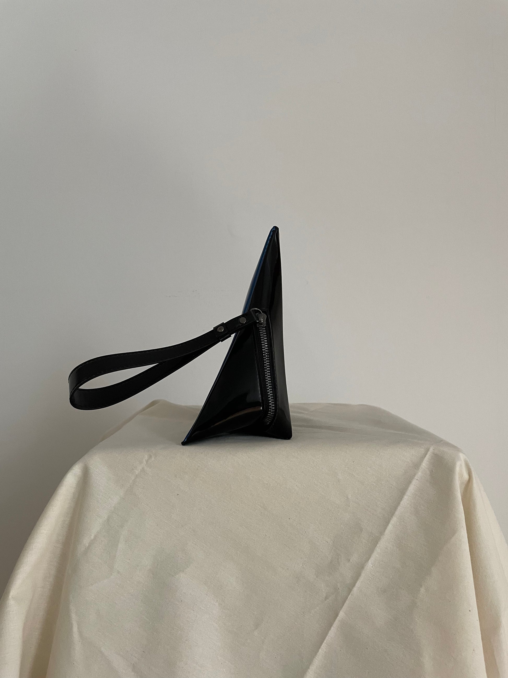 Issey Miyake blue and black triangle clutch with strap