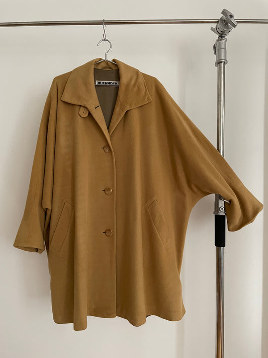 Front view of vintage womens Jil Sander 1980s camel dolman sleeve coat