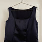 Detail view of vintage womens Comme des Garçons black midi dress with geometric panels