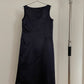 Back view of vintage womens Comme des Garçons black midi dress with geometric panels